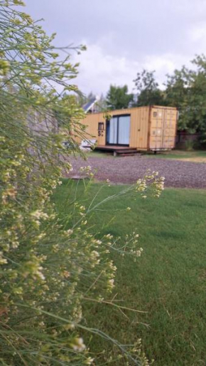Cubil Amarillo. Casa conteiner 1 dormitorio
